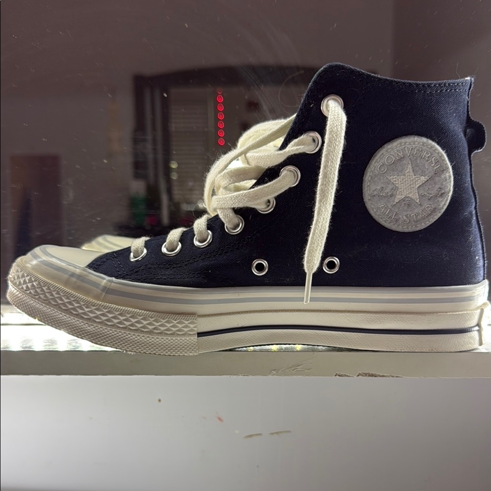 Converse Black and White High-Top Sneakers with Iconic Design